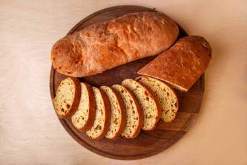 sliced sliced fresh bread on a wooden board