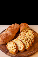 sliced sliced fresh bread on a wooden board