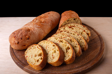 sliced sliced fresh bread on a wooden board