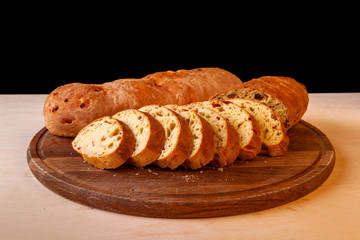 sliced sliced fresh bread on a wooden board