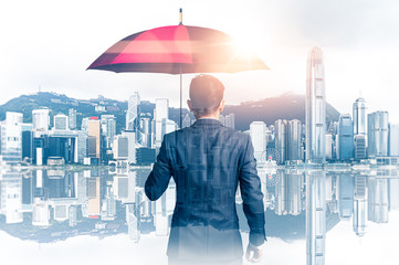 The double exposure image of the Businessmen are spreading umbrella during sunrise overlay with...