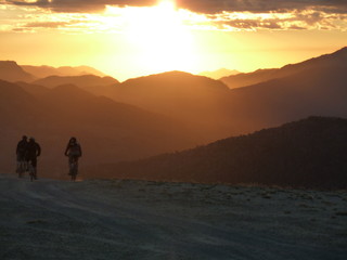 biking in a beautiful sunset in the mountains