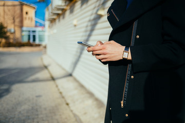 Closeup female hands holding mobile phone