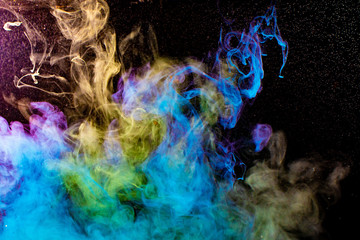 colorful smoke on black background. soft smoke clouds abstract background