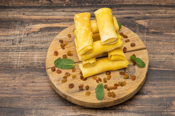 Frozen pancakes on a wooden background