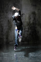 Young beautiful dancer is posing in studio