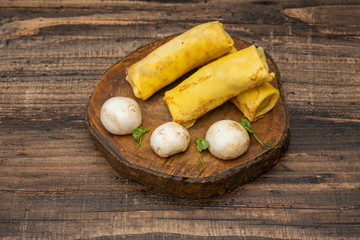 Frozen pancakes on a wooden background