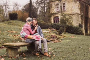 couple sitting on the bench full of love