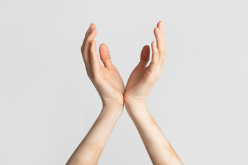Chronic skin disease. Female hands with vitiligo spots