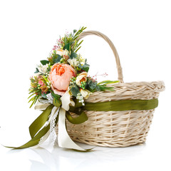 Fototapeta na wymiar Handmade Easter basket in Provence style decorated with ribbons, flowers isolated on white.