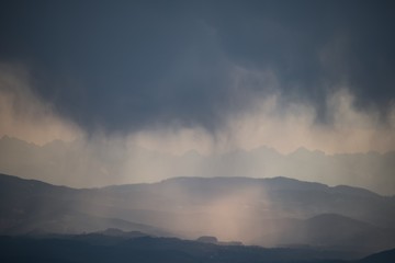 raining clouds during sunset