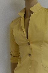 Yellow female jacket close-up. Discounts. clothes sale. Shop online. Delivery of clothes.