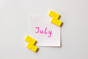 Sticky note on the white background. Business/education memo summer planning. Summer months motivation notes. July