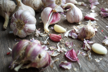 Garlic cloves on a vintage wooden background.