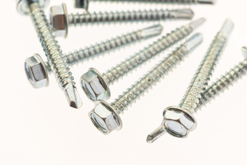 sheet metal and stainless steel screws together with hex nuts