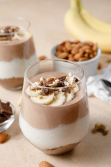 Chia seeds pudding with chocolate and banana smoothie in a glass