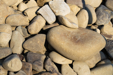 Pattern of stones and cobblestones with rounded edges.