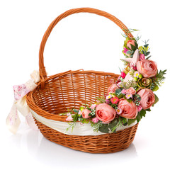 Provence Easter floral arrangement on a wicker basket with a vine. Isolated - obrazy, fototapety, plakaty