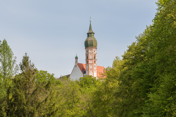 Church of Andechs abbey behind trees