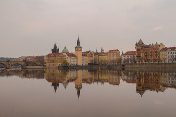 
view of the river and reflections in it. Old Prague architecture by the river Vltava. In the Czech Republic
