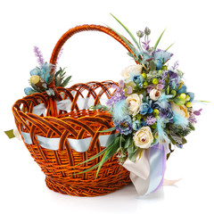Fototapeta na wymiar Stylish brown wicker Easter basket with very beautiful pastel decor. Decorated with many different flowers and ribbons.