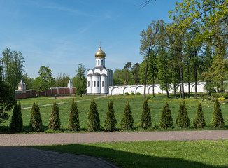 Fototapeta na wymiar DZERZHINSKY, MOSCOW REGION, RUSSIA - may 2018: Exterior of the Nikolo-Ugreshsky Monastery, courtyard view. Founded in 1380. Monastery wall.