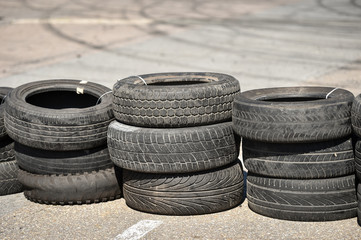 Safety barrier made of used tires inside a driving school polygon