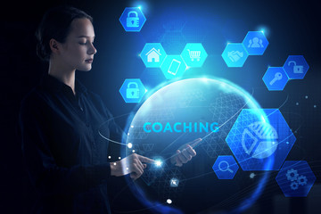 Business, Technology, Internet and network concept. Young businessman working on a virtual screen of the future and sees the inscription: Coaching