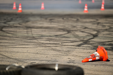 Rubber drift traces and traffic cones inside a driving school polygon