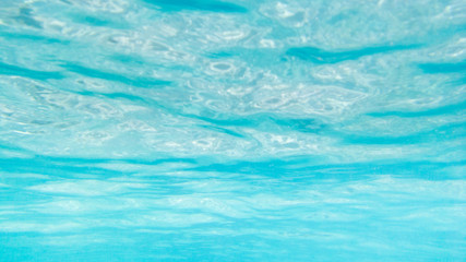 Under ocean ripple wave background texture.