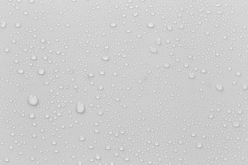 The concept of raindrops falling on a gray background Abstract wet white surface with bubbles on...