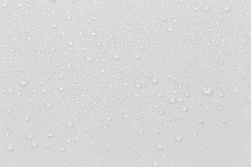 The concept of raindrops falling on a gray background Abstract wet white surface with bubbles on...