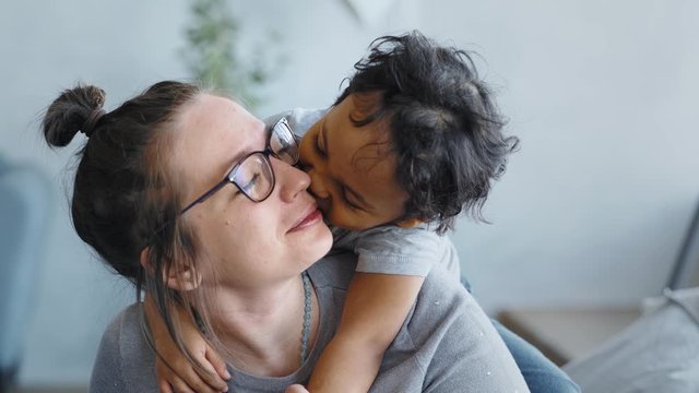 Happy family african american mixed race kid boy and caucasian mom