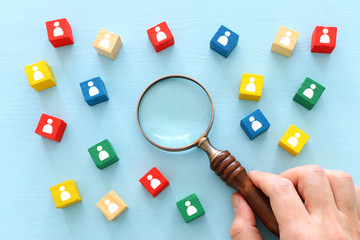 image of colorful blocks with people icons over wooden table ,human resources and management concept