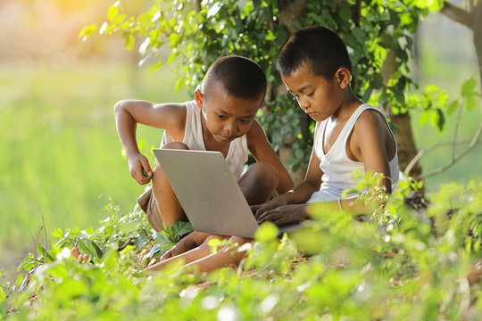 Two Boy In The Countryside Is Studying Via Wireless Internet.