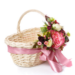 Fototapeta na wymiar Wicker basket decorated with flowers on white background