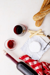 Glass of red wine served with cheese