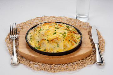 Chicken turkey in cream sauce with cheese and herbs.