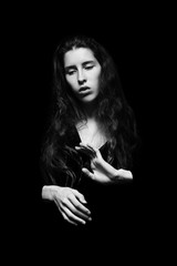 Fototapeta premium silhouette of a young woman with hands