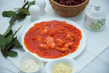 Tomato Pickle . Chicken and tomatoes . Red Dry Pepper in Traditional Basket . Tomato Pickle . Chakhokhbili - chicken stewed with tomatoes and onions. salt, pepper. Red Dry Pepper in Basket .