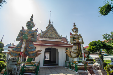 Fototapeta premium Bangkok, Thailand - January, 2020: The Temple of Dawn Wat Arun and a beautiful blue sky in Bangkok, Thailand