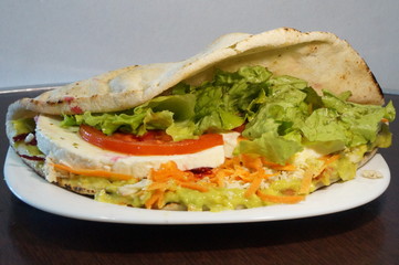 Healthy bread sandwich with salad. Tomato, lettuce, cheese, carrot.