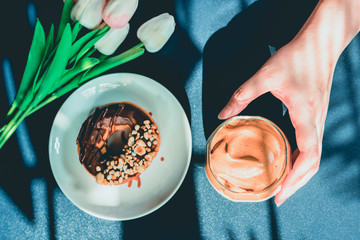 flay lay favorite and trend of summer drink from dalgona or frothy coffee with beauty hand on classic blue and shadow of palm tree background