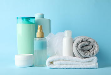 Fototapeta na wymiar Body care products on blue background. Personal hygiene