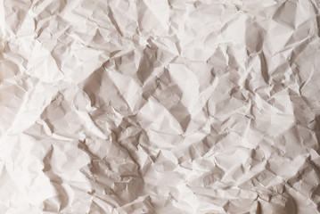 Crumpled white paper background.