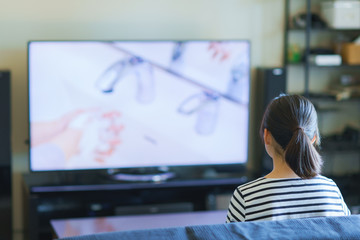 Japanese young woman watching tv
