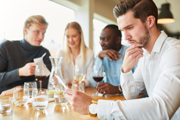Guest in the restaurant thinks about his order