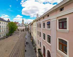 Fototapeta premium Aerial view on Market square, Dormition and Carmelite Church in Lviv, Ukraine from drone