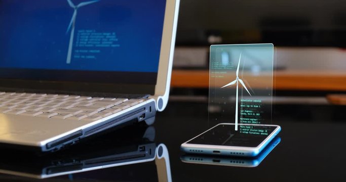 Futuristic Wind Turbine 3D Hologram animation connected to a phone display next to a laptop. Augmented virtual reality modeling software.