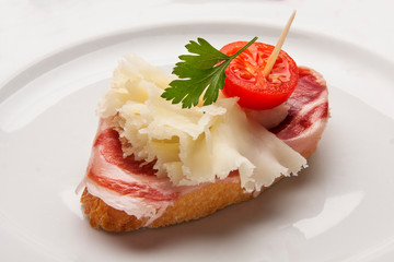  typical spanish food pintxo of iberian ham and cheese